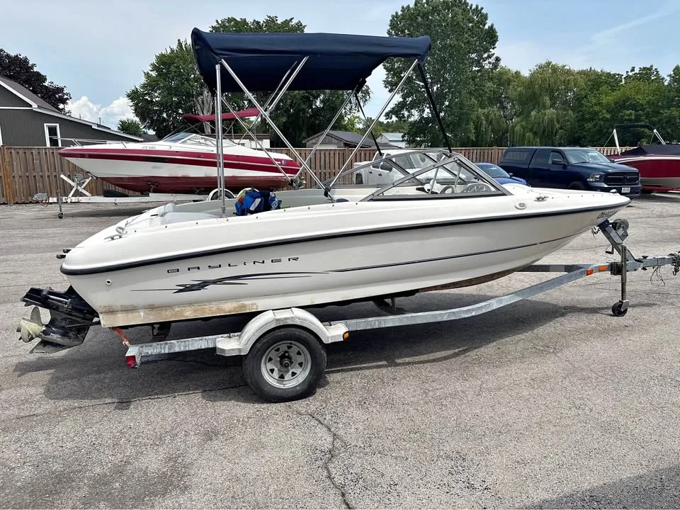 2005 Bayliner 175 Bowrider on its trailer with the bimini top up