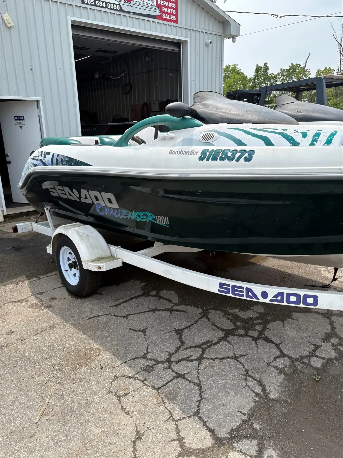 1997 Sea-Doo Challenger 1800 jet boat on its trailer outside Hartzel Marine in Dunnville